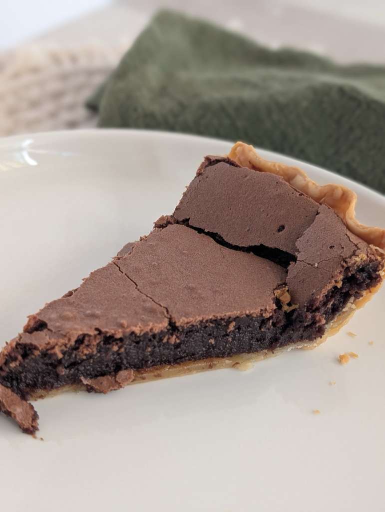 Slice of chocolate chess pie from Happy Hippo Bakery