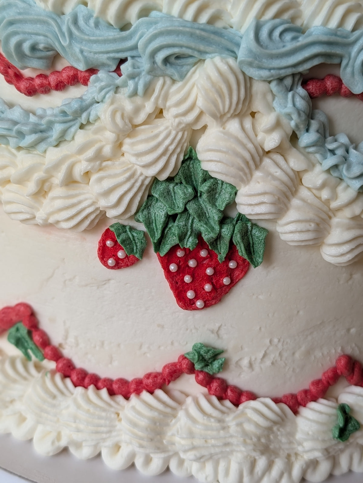 Vintage strawberry cake with detailed piped buttercream by Happy Hippo Bakery in Hutto, Texas by Happy Hippo Bakery