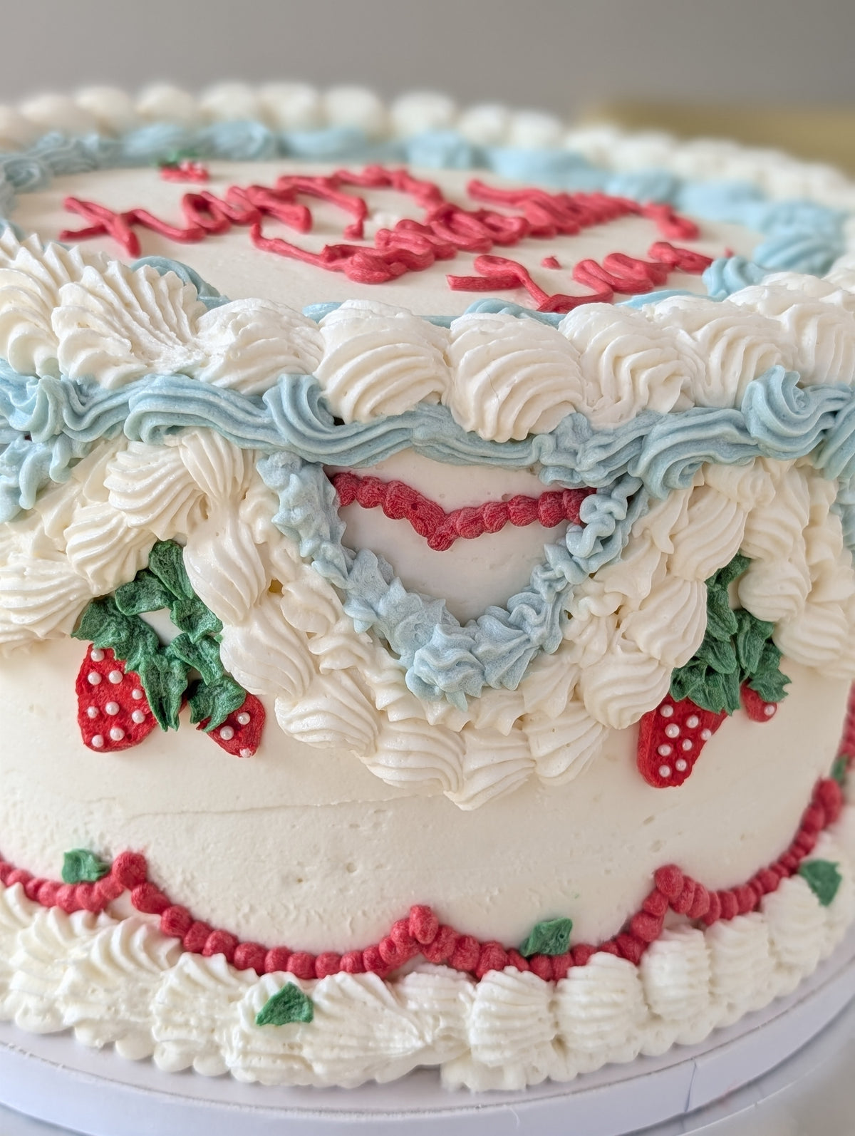 Vintage strawberry birthday cake with piped buttercream by Happy Hippo Bakery in Hutto, Texas